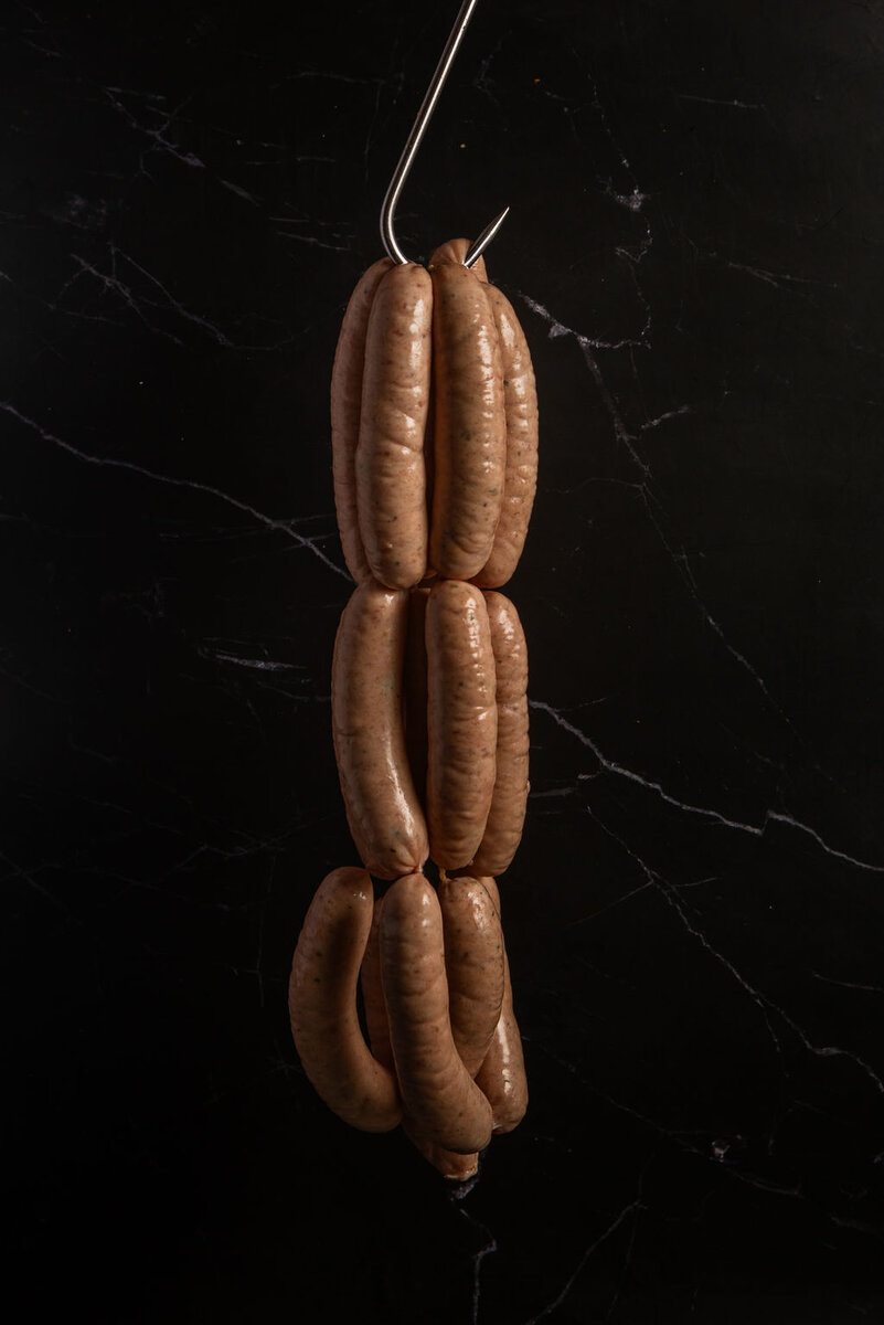 Butcher-made Cumberland sausages, hand-linked